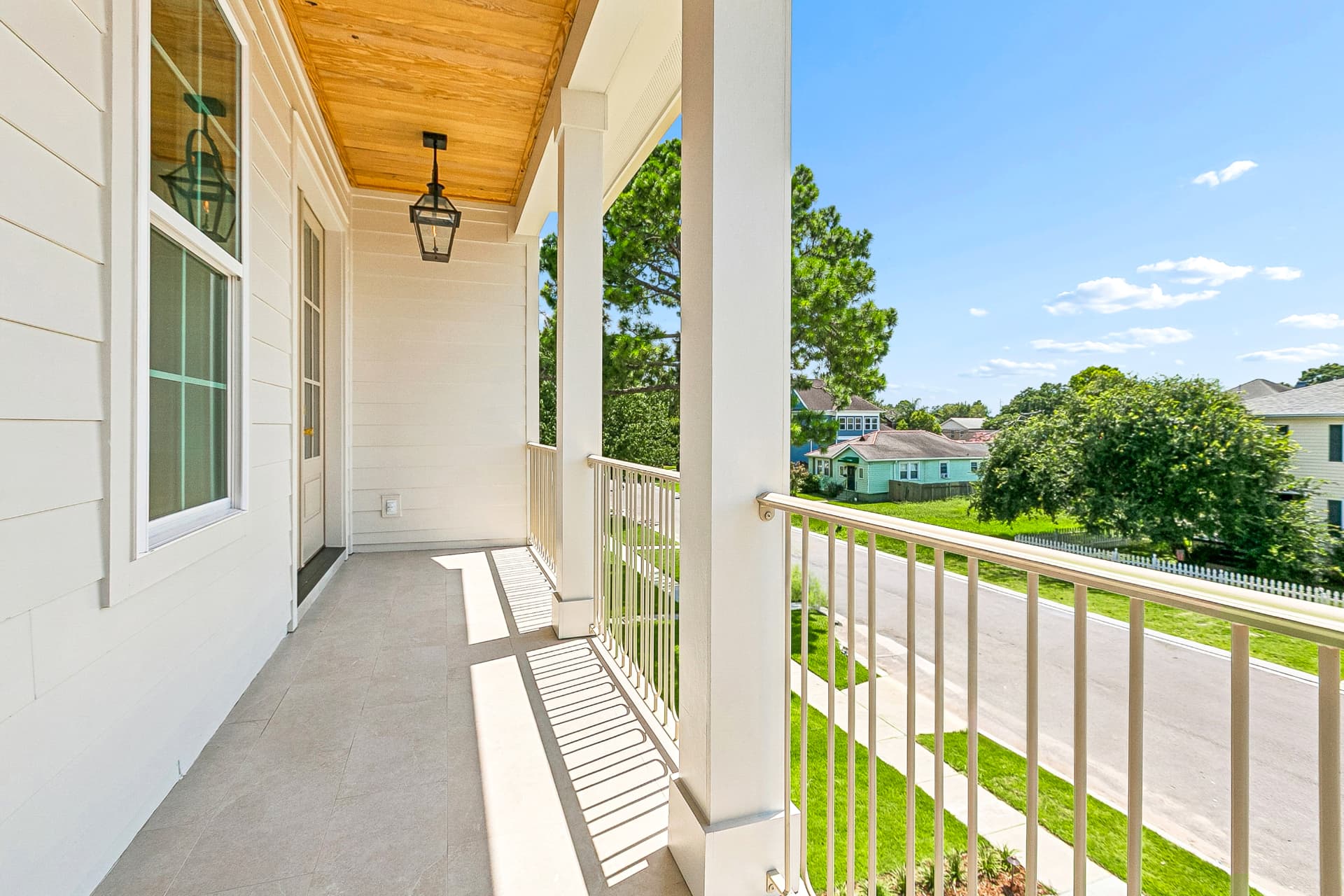 Second-floor balcony with tongue-and-groove ceiling