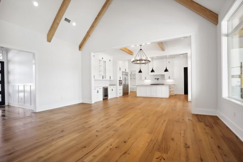 Vaulted living room with exposed wood beams