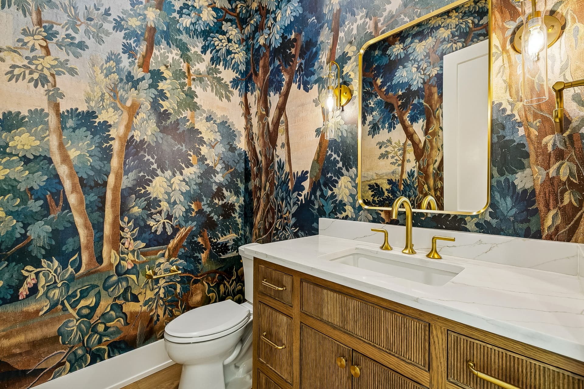 Powder room with scenic mural wallpaper and wood vanity